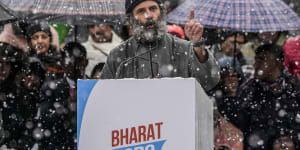 India’s opposition Congress party leader Rahul Gandhi,speaks at a public rally as it snows in Srinagar,Indian controlled Kashmir.