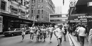 The City Tattersalls Harriers runners on Castlereagh Street,led by gymnasium director George Daldry.