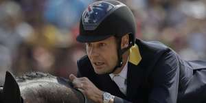 Chris Burton rides Santano II to clinch a team bronze medal for Australia in the equestrian