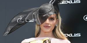 Lady Kitty Spencer at the 2019 Melbourne Cup,wearing a hat by Stephen jones and dress by Roland Mouret.