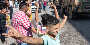 Turkish tanks escort the Free Syrian Army into Syria on October 10. 