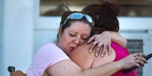 Carrie Matula embraces a woman after a fatal shooting at the First Baptist Church in Sutherland Springs,Texas,on Sunday.