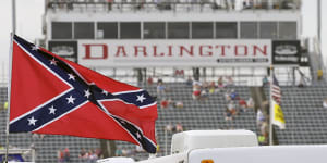 A Confederate flag flies in the infield before a NASCAR Xfinity auto race at Darlington Raceway in South Carolina in 2015. 