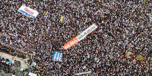 People take part in a demonstration supporting Israeli Prime Minister Benjamin Netanyahu and his nationalist coalition government’s judicial overhaul,in Tel Aviv on Sunday.