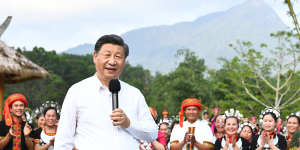 Xi visits villagers in Hainan province in April 2022 to inspect projects tackling poverty and rural rejuvenation.