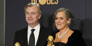Plenty more where they came from! Christopher Nolan,left,and Emma Thomas with their Golden Globes.