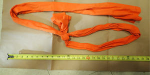 A piece of fabric used as a noose is displayed as part of the investigation into Epstein’s death.