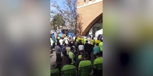 Some council workers repeated the chant after the leader said it,before adding,"We're doing a commercial".