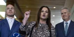 Senators Jacqui Lambie and David Pocock with Burke on Thursday.