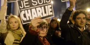 People in Spain join a demonstration to show their solidarity for the slain Charlie Hebdo journalists outside the French Consulate in Barcelona.