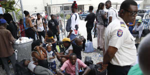 Haitians waiting to board a flight to Nicaragua gather after the government banned all charter flights to Nicaragua,at Toussaint Louverture International Airport in Port-au-Prince,Haiti.