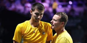 Alexei Popyrin is consoled by Lleyton Hewitt after his defeat.