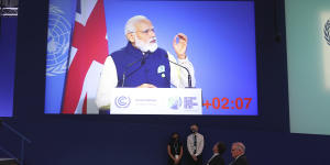 Netherlands PM Mark Rutte and Scott Morrison listen as India’s PM Narendra Modi speaks at the climate summit.