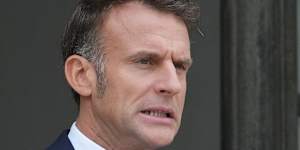 French President Emmanuel Macron waits for Jordan's Crown Prince Hussein at the presidential Elysee Palace on Wednesday,October 8.