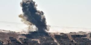 Desperate battle ... smoke rises from the Syrian town of Kobane as Kurdish forces defend it from Islamic State militants.