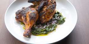 Barbecued chicken with rose harissa and warrigal greens,one of Rumi’s new dishes.