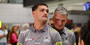 Nathan Cleary (left) and his dad Ivan Cleary at Brisbane airport on Saturday night. 