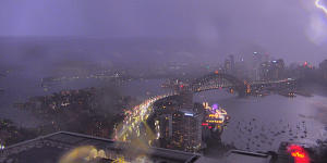 Cars damaged when storm dislodged Harbour Bridge road plate