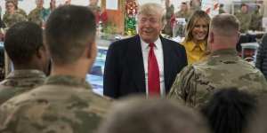 Donald Trump speaks during a visit to one of the targeted airbases - the Ain Asad airbase - in December 2018.