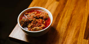 The marinated goat stew takes locally sourced goat and cooks it in a sauce of tomatoes,red capsicum,habaneros,onions and traditional Nigerian spices.