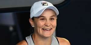 Ash Barty has a laugh during practice.