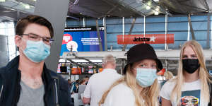 Julian Seesink,Muriël De Kroon and Iina Mäkelä queue at Sydney Airport on Tuesday.