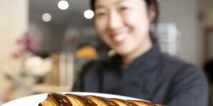 Co-founder Frances Song with a chocolate bar croissant at Moon Phase in St Leonards.