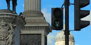 A gender neutral pedestrian light at Trafalgar Square,London. 