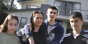 Katherine Maiorca and her children (L to R) Imogen (12) Nicholas (16) and Sammy (14) in front of their family home in Sutherland which has had major defects during its construction. 
