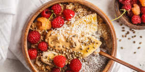 TikTokers are sharing highly styled porridge bowls with toppings such as chia seeds,berries,peanut butter and hemp seeds (pictured).