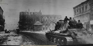 A Russian tank of the First Ukrainian Army rolls along a street in Gleiwitz,German Silesia,following the capture of the city by Soviet Forces,on February 5,1945.