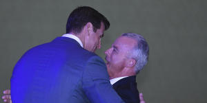 The Director of the Australian War Memorial Brendan Nelson (right) hugs Ben Roberts-Smith.