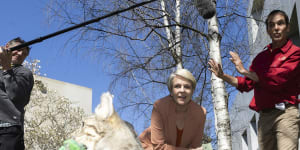 Tanya Plibersek views a demonstration of a feral cat trap during a Threatened Species Day event.