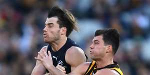 Lachie Plowman,left,and Jaeger O’Meara collide during round 10. 