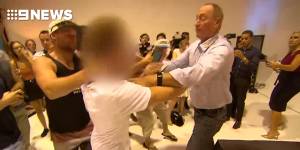 Fraser Anning strikes the young activist who egged him.