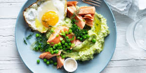 Ocean trout with green mash,peas and a fried egg.
