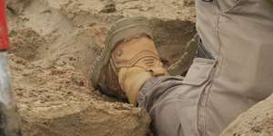 The dig on Ocean Grove beach involved a jackhammer,excavator and perfect timing.