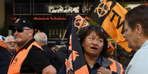 ‘We’re pushed to the max’:Bus driver Jacque Wilson,centre,at the rally in Martin Place on Monday.