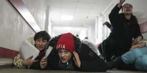 This image captured by Chernov’s colleague Evgeniy Maloletka shows residents of Mariupol cowering in a hospital corridor during a missile attack. 