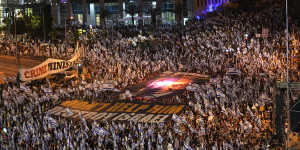 A protest in Tel Aviv on Saturday. Israel’s biggest cities have experienced some of the biggest protests in the nation’s history over recent months,even after Netanyahu announced he was pausing his planned changes.