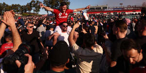 Andrea Agamemnonos celebrates victory with of Sydney United 58 fans.
