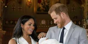 The Duke and Duchess of Sussex with newborn son Archie in St George’s Hall at Windsor Castle.