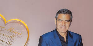 Burmeister’s Melbourne clinic,known as the"pink palace",features George Clooney in life-size cardboard. 