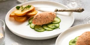 A quenelle of trout rillettes with cucumber and crostini.