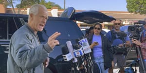 Former Trump White House official Peter Navarro speaks to reporters before he heads to prison in Miami.