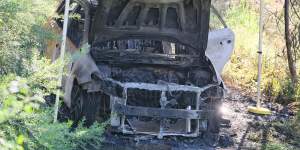 A second burnt out car linked to a fatal Craigieburn targeted shooting sits wrecked on the Merri Creek’s banks on Sunday.