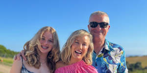 Elliott in one of his trademark Hawaiian shirts,with daughter Ava and wife Elise.