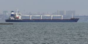 A carrier starts its way from the port in Odessa loaded with corn.