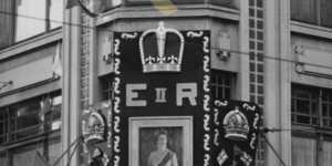 A portrait of the newly-crowned Queen is erected at Prouds on Pitt Street,Sydney on June 5,1953