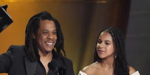 Jay-Z accepts the Dr. Dre global impact award with daughter Blue Ivy Carter.